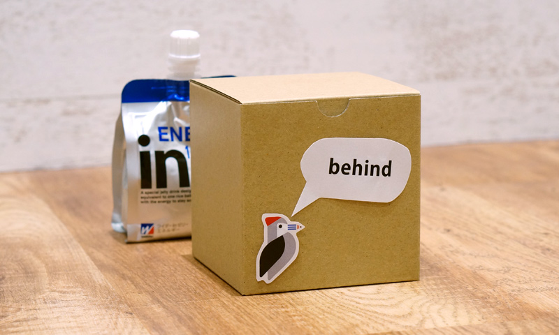 behind
