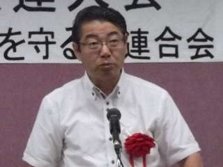 生健会県連大会で来賓あいさつをするまじま省三氏