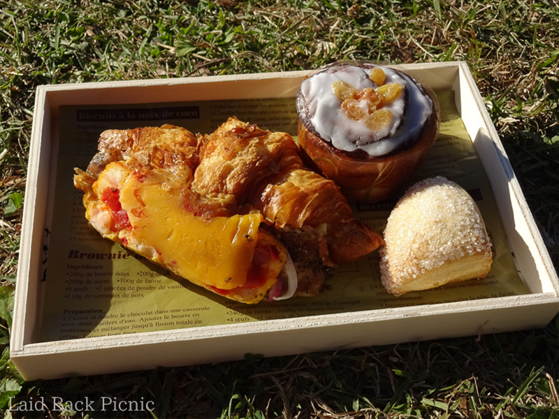 There are bread and scones besides croissant sandwich