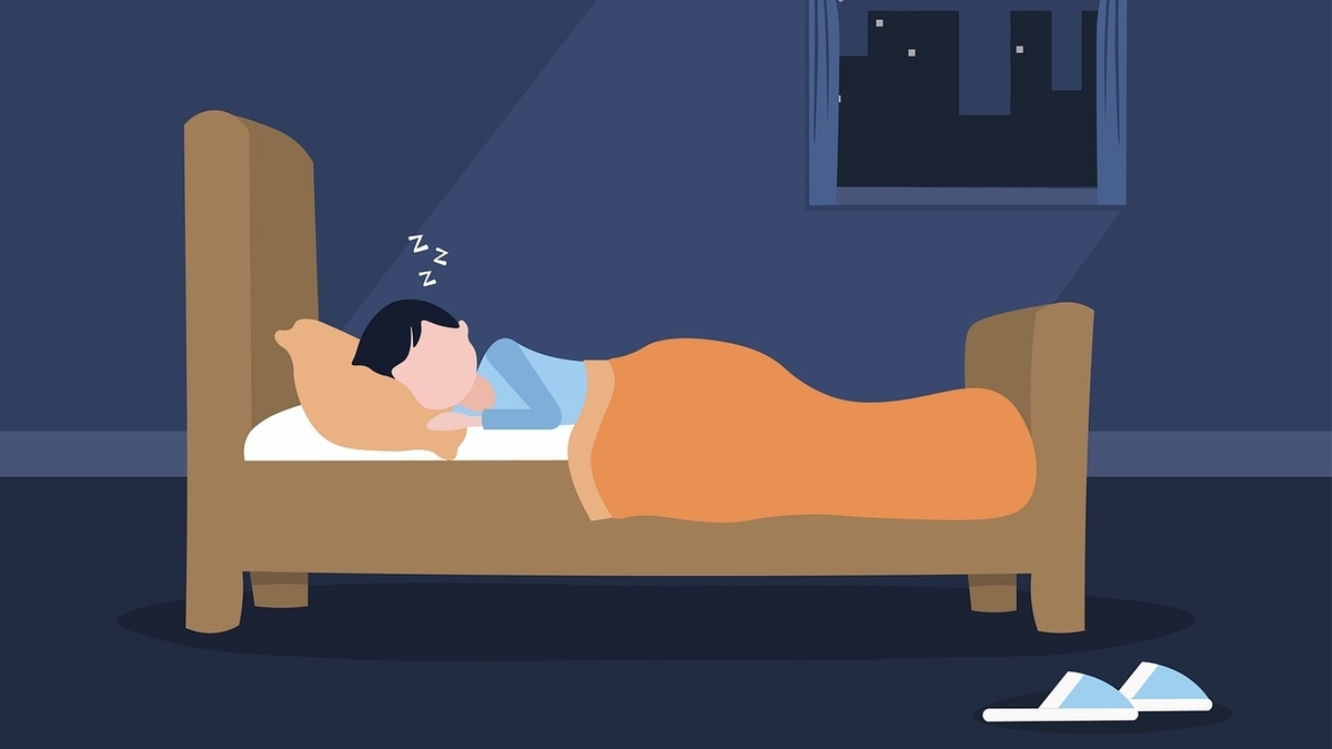 夜ベッドで眠っている人のイラスト