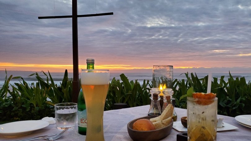 enjoy the beer and cocktail with the beautiful sunset ocean view