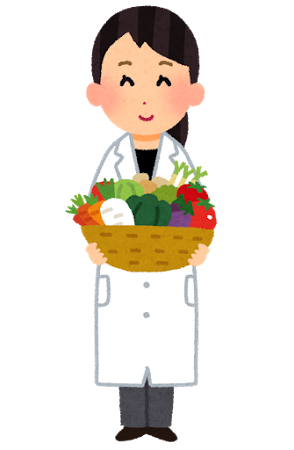 白衣を着た栄養士 白衣を来て食べ物を持っている人