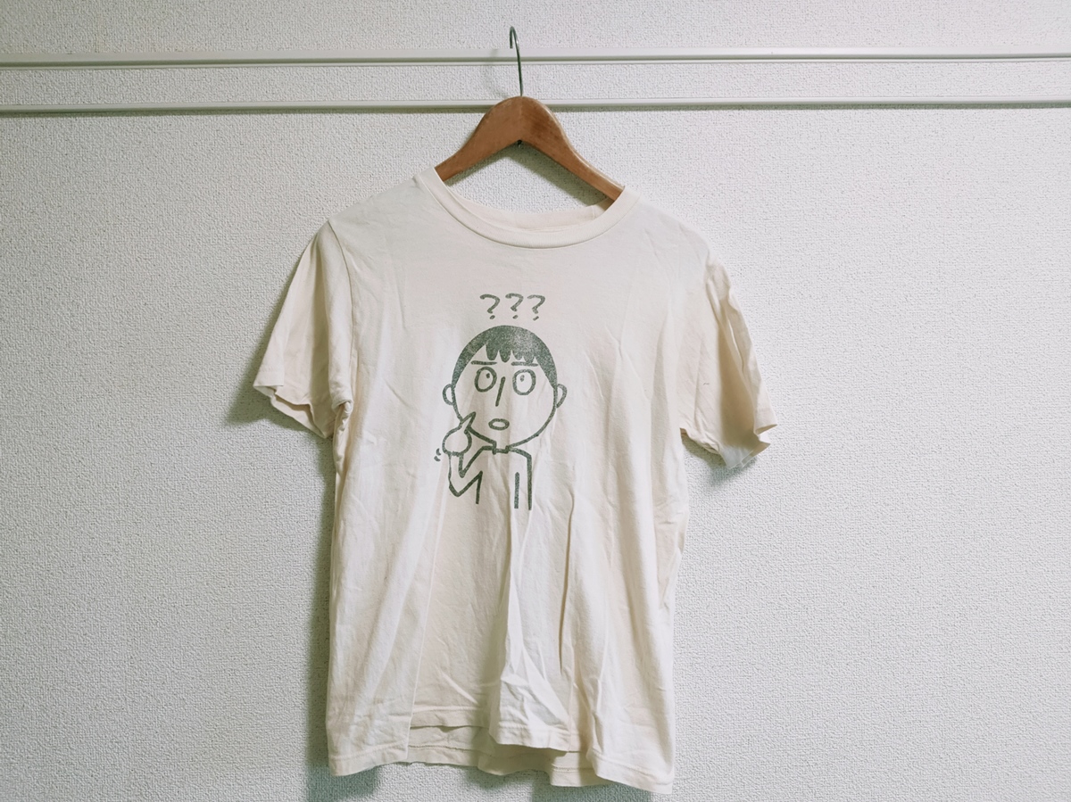 似顔絵入りの古いTシャツ