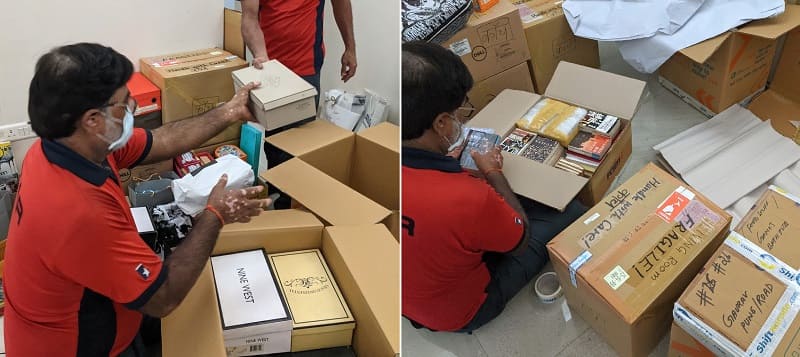 荷物を梱包し直す作業員