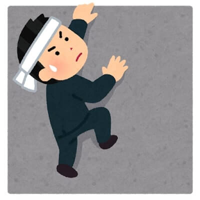 壁を上る男
