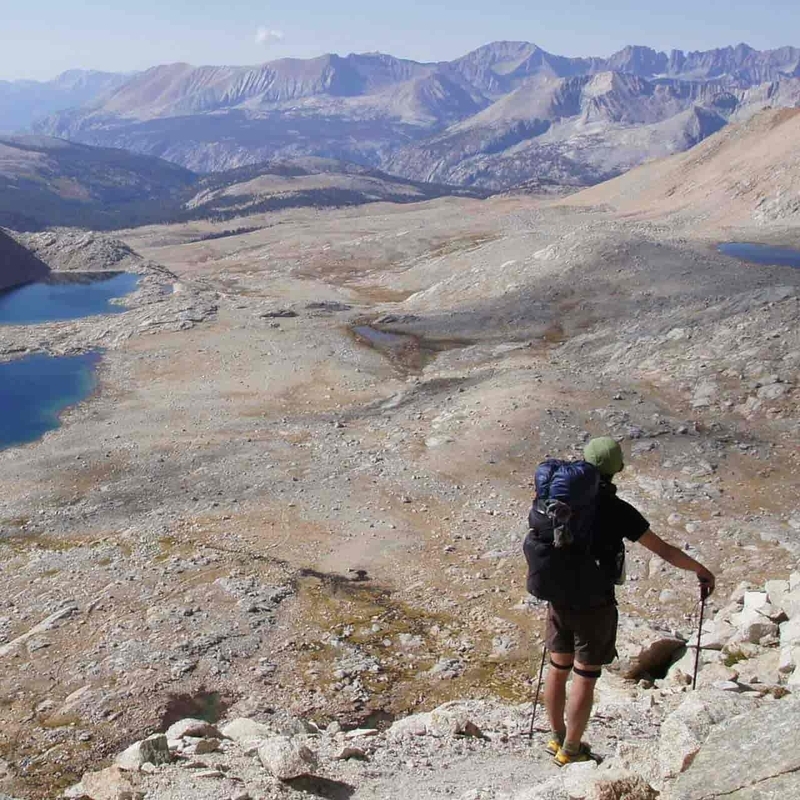 Yamatomichi ONE backpack being worn on a rocky mountain ridge