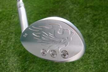 EMILLID BAHAMA EB-55 wedge at impact position — bounce and loft working together