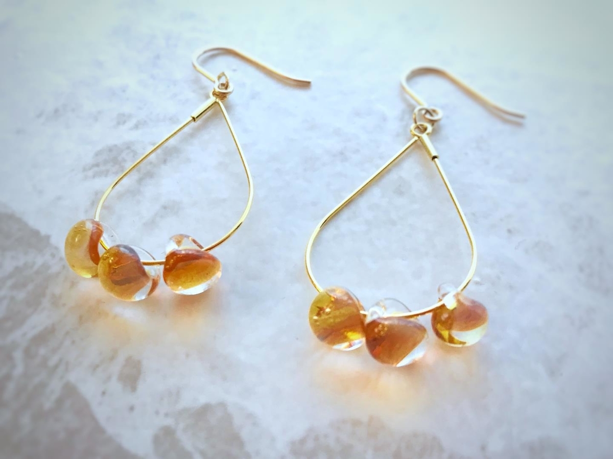 オレンジ フープピアス