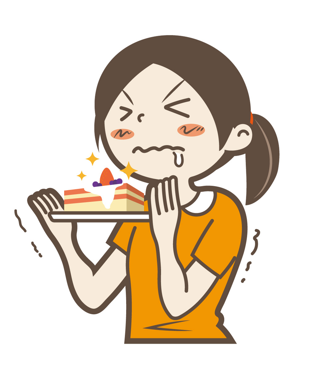 甘いものを我慢する女性