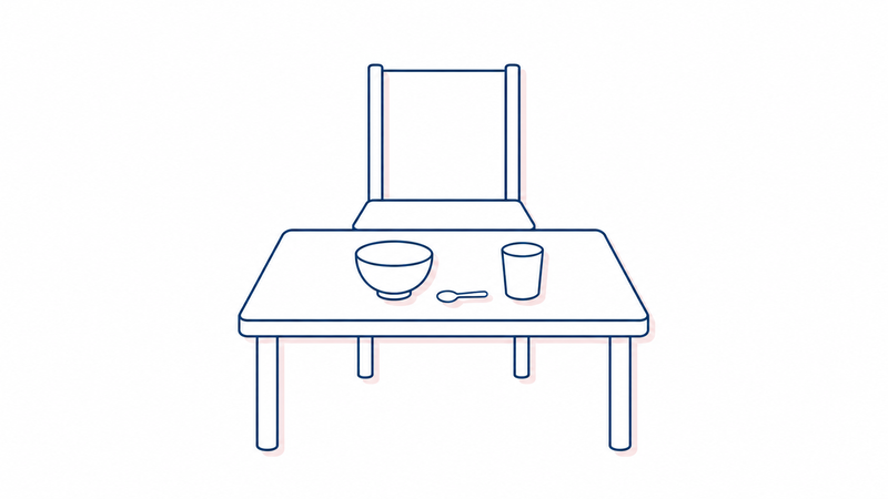 背もたれのある椅子と、茶碗・小さめのスプーン・コップが置かれた食卓の線画イラスト。まっすぐ起きた姿勢で、一口を少なめにして食べる工夫を表している