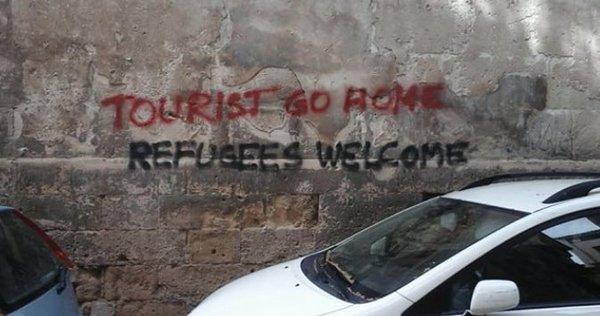 welcome refugee go home bad tourist