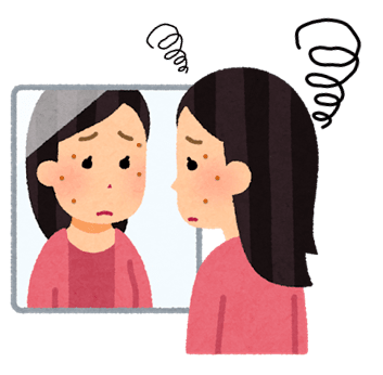 シミを気にして鏡を見つめている女性