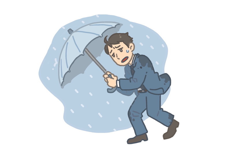 傘を指している男性