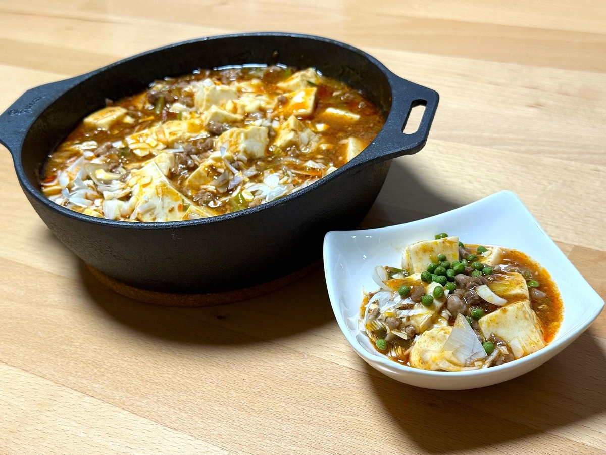 麻婆豆腐に実山椒の塩漬けを加えた仕上げの一皿