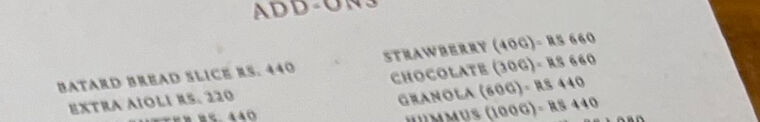 メニューのADD-ONSの欄。GRANOLA (60G) - RS 440、STRAWBERRY (40G) - RS 660、CHOCOLATE (30G) - RS 660などが並ぶ