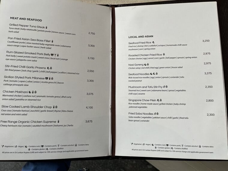 57のメニューのMEAT AND SEAFOODとLOCAL AND ASIANの見開きページ。Slow Cooked Lamb Shoulder Chop 4,100、Seafood Noodles 3,375などの価格が並ぶ