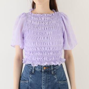 パープルのトップス
