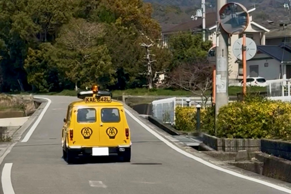 Classic Mini AA van driving through a quiet countryside road in Japan, first driving experience