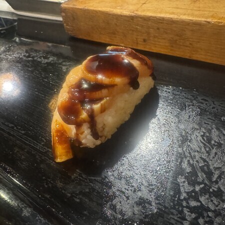 The last nigiri was scallop... The sweet sauce was delicious.