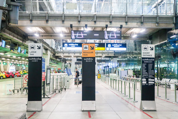 Go to ticketing machine lane and choose the size of the taxi to ride
