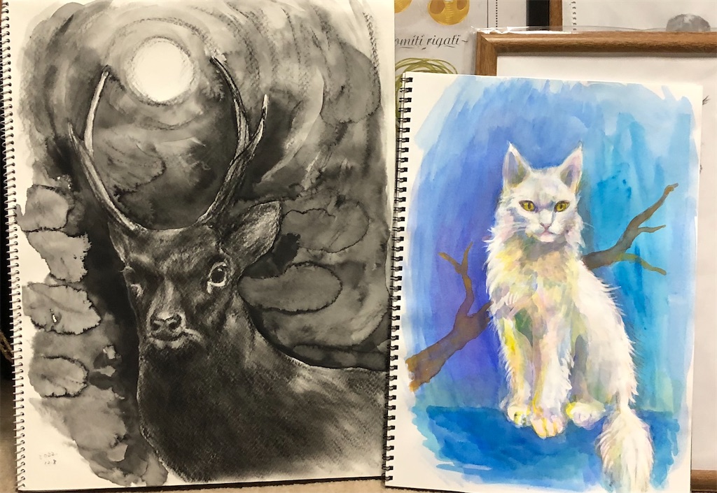 鹿と白い猫の絵