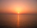 佐渡からの帰路　彼方に沈む夕日かな