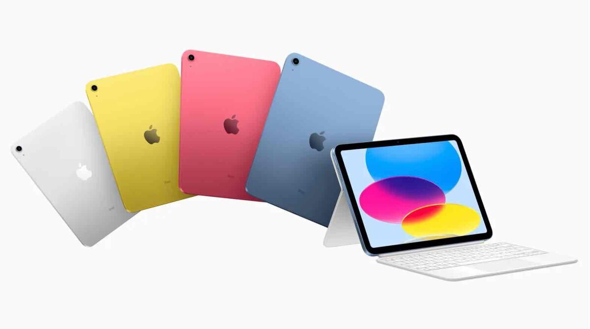 iPadの4色（ホワイト・イエロー・ピンク・ブルー）が背面を向けて並び、右側にはキーボードと組み合わせたiPadが正面向きで表示されている