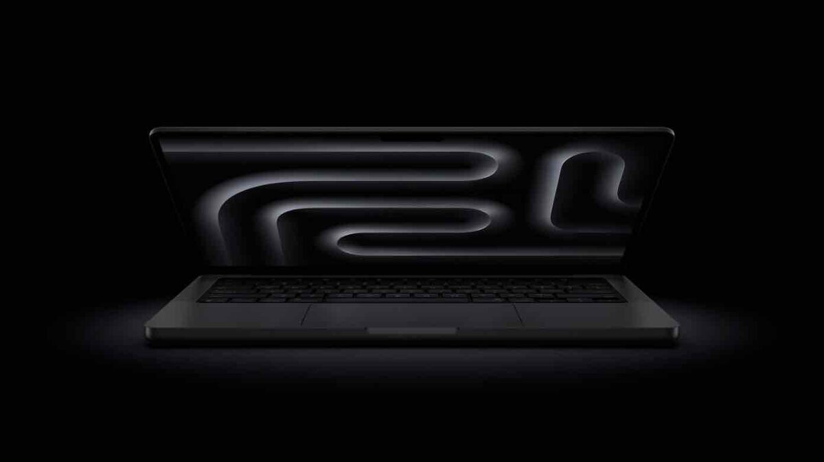 暗い背景の中で開いたMacBook Proのシルエット。ディスプレイにはMシリーズチップを想起させる抽象的な発光ラインが描かれているイメージビジュアル