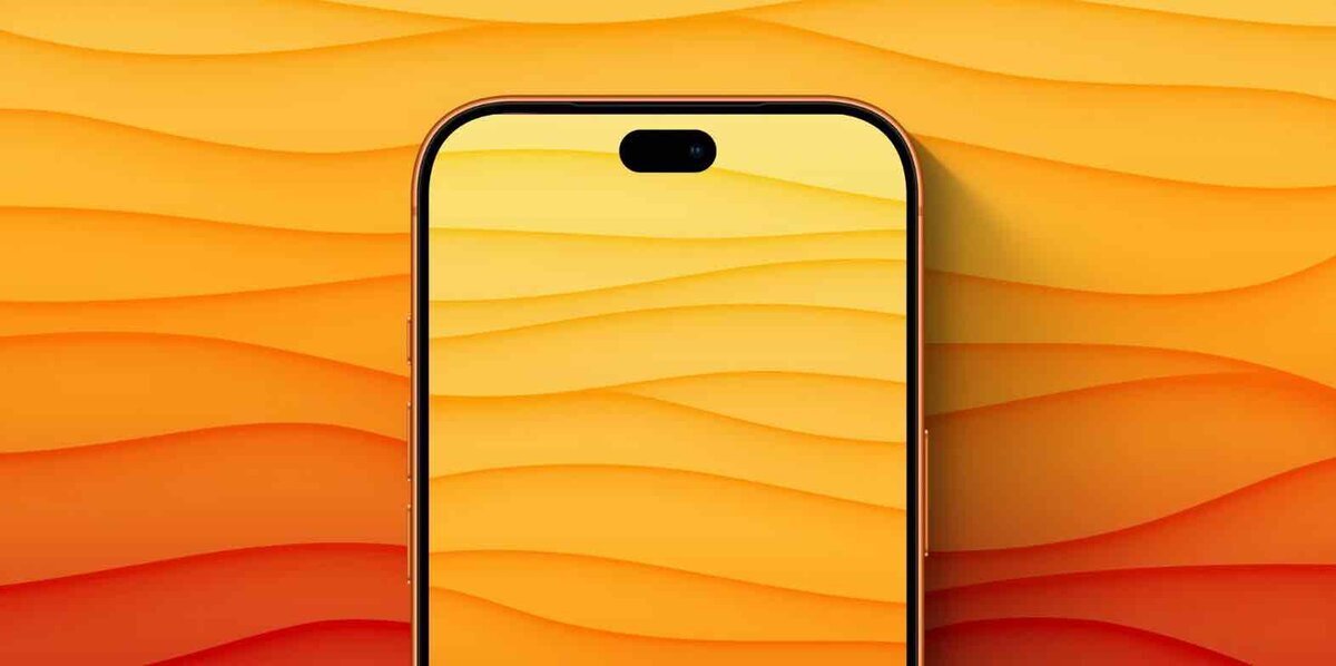 オレンジ色の背景に表示されたiPhoneの上部。画面上部にはDynamic Islandがあり、端末の細いベゼルと側面ボタンが見えている