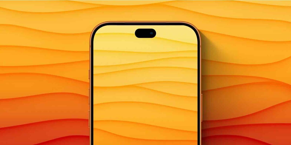 オレンジ系の背景に置かれたiPhoneの前面。画面上部のDynamic Islandが表示されている