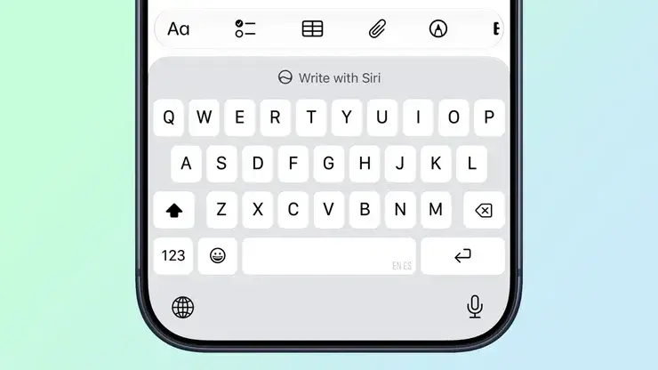 iPhoneのキーボード上部に表示されたWrite with Siriのボタンと、その上に並ぶ作文ツールバー