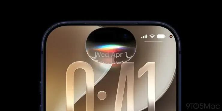iPhone上部の接写。横長のDynamic Islandの中で虹色の光が揺らぎ、右側にアンテナ・Wi-Fi・バッテリーのアイコンが並ぶ