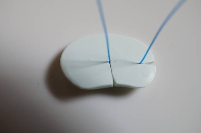 Custom resin chip with a curved tip and pronounced rear narrowing