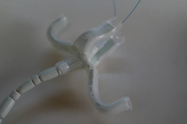 The gatekeeper retainer has an epoxy resin body with silicone coating
