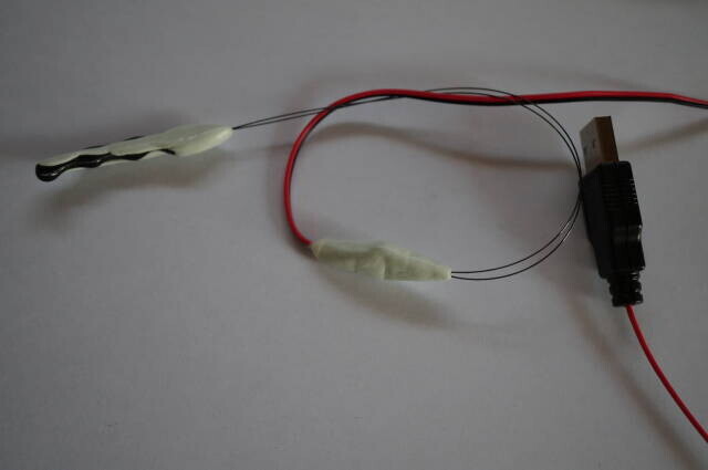 The twin-wire prototype connects a ceramic chip to a separate motor.