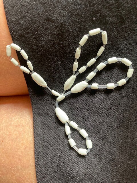 Beaded wire prototype accompanying Mr. Okada's report of unexpected insertion difficulty.