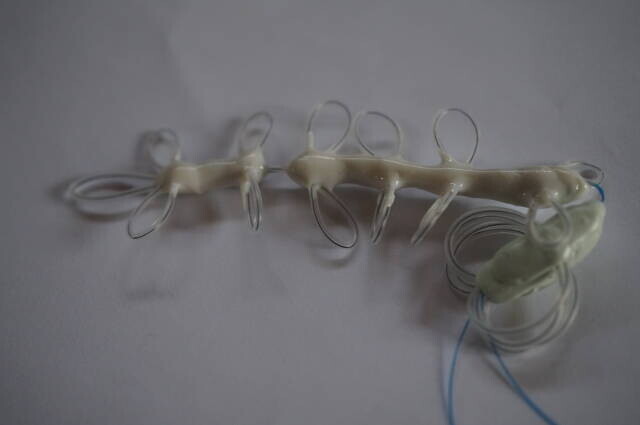 The separated wire assembly and stopper discussed in July.