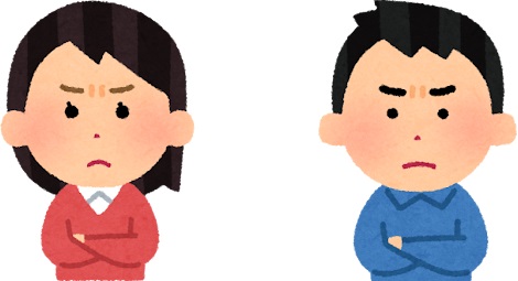 厳しい表情の男女