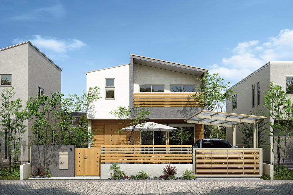 住宅とコーディネートした木調の門扉