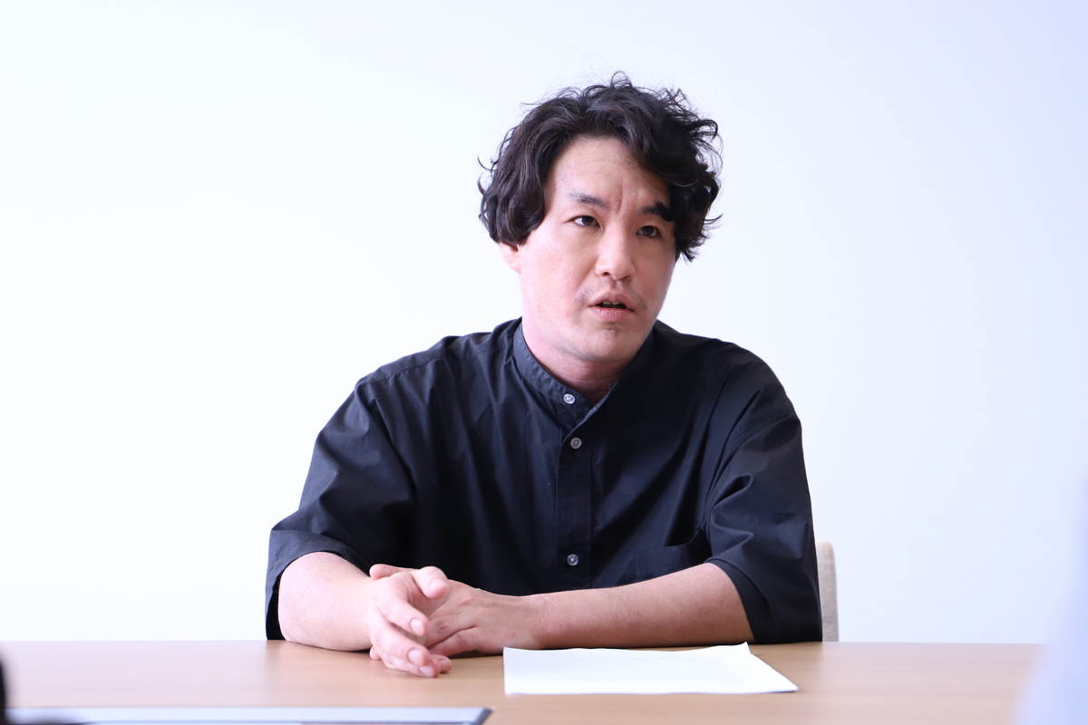 デジタルプロモーション事業本部　テクニカルディレクション部　部長　熊谷周大さんの写真