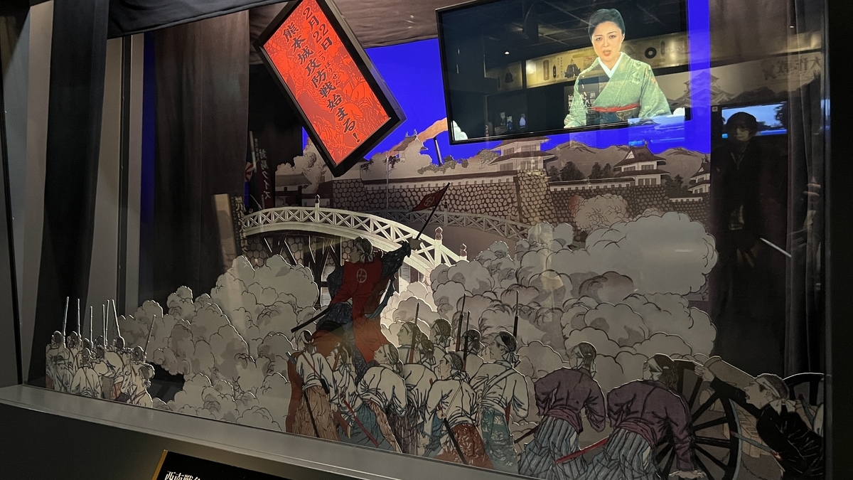 西南戦争の切り絵舞台と解説映像が一体になった展示ケース