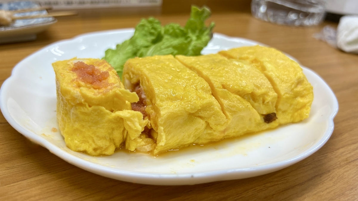 明太子の断面が見えるとろりとした玉子焼きのアップ
