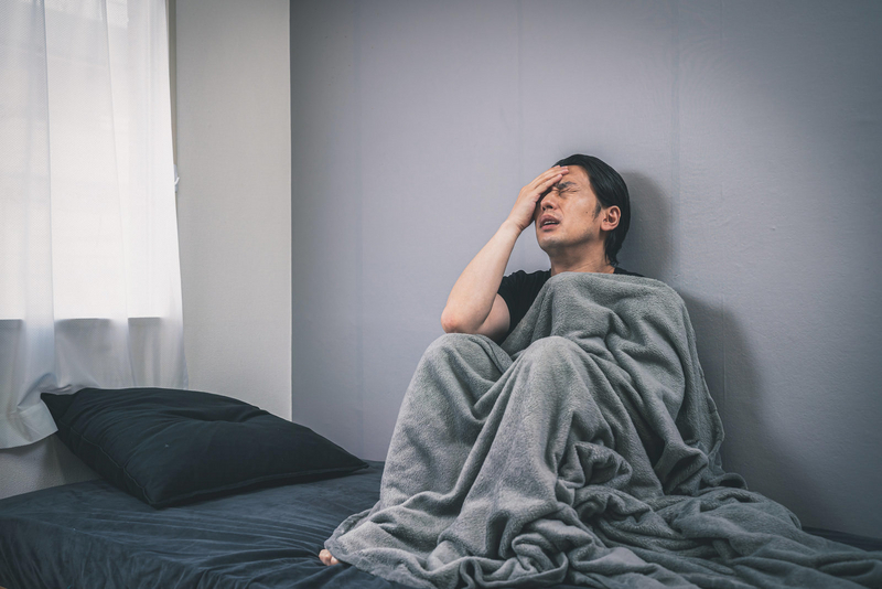 体調が悪そうな男性の画像