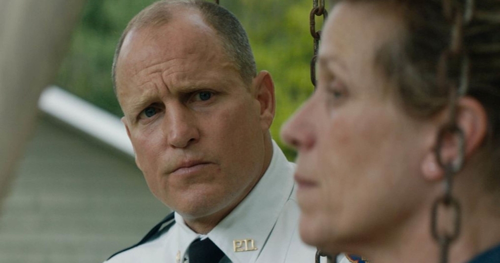 middle age police with no hair from the scene of Three Billboards Outside Ebbing, Missouri