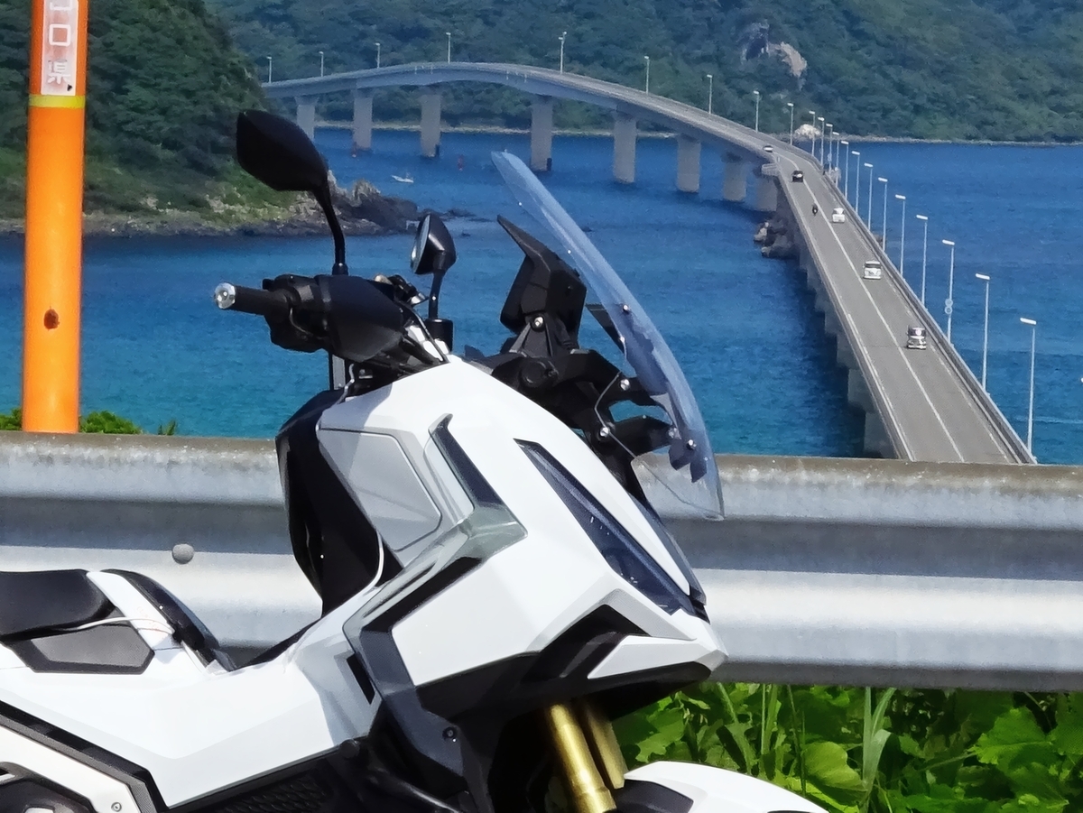 Route the USB power cable from the X-ADV's trunk space to the handlebars.