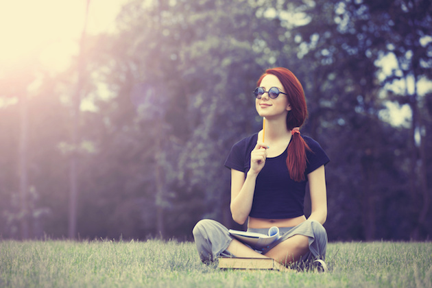 Young girl in indie style clothes with