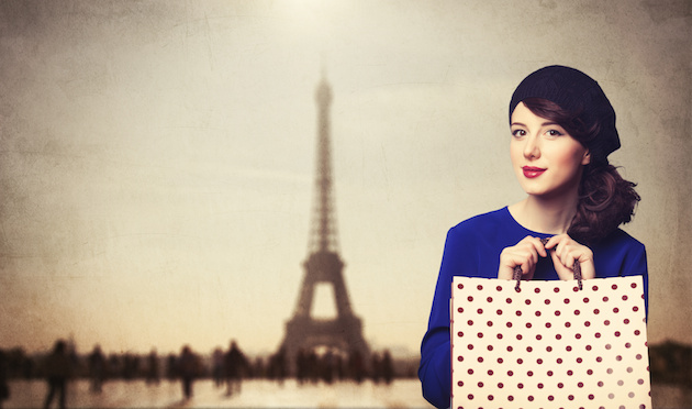 women in blue dress with shopping bags