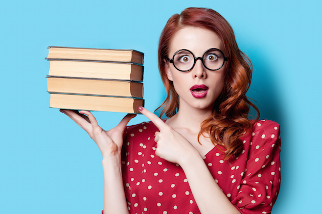 girl in red dress with books