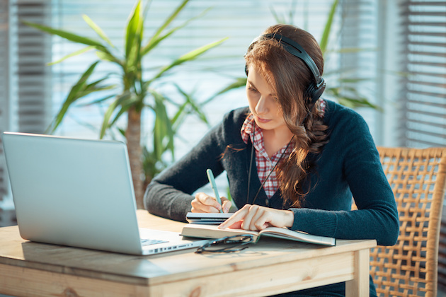 Girl with headphones and laptop