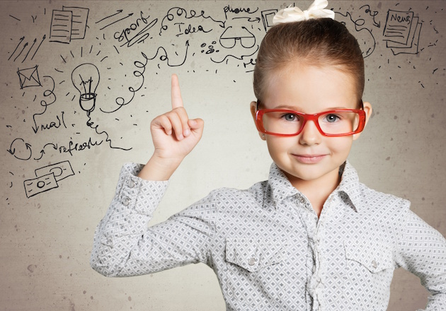 Boy. Genius boy in red glasses near blackboard with formulas